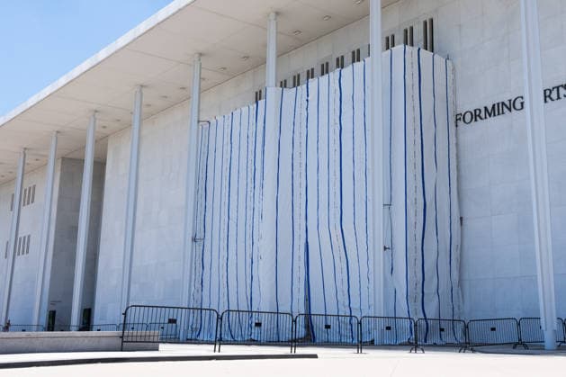 A tarp covers the sign for the Donald J. Trump and The John F. Kennedy Memorial Center for the Performing Arts in Washington, DC on Saturday, June 13, 2026. The Kennedy Center board voted to seek an emergency appeal to block a court order requiring the removal of President Trump s name from the Kennedy Center, but a judge denied their request.  WAP20260613051 AARONxSCHWARTZ