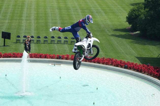 A motor sports athlete and stunt performer does a motorcycle jump ahead of the UFC Freedom 250 fights on the South Lawn of the White House in Washington, DC on Saturday, June 13, 2026.  WASP20260613108 MarkxSchiefelbein