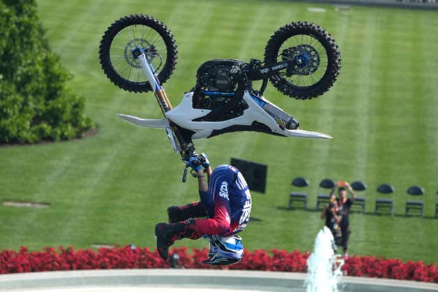 A motor sports athlete and stunt performer does a motorcycle jump ahead of the UFC Freedom 250 fights on the South Lawn of the White House in Washington, DC on Saturday, June 13, 2026.  WASP20260613107 MarkxSchiefelbein