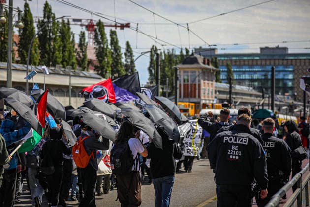 June 13, 2026, Berlin, Berlin, Germany: Demonstrators march through the streets of Berlin, Germany, protesting against the expansion of police surveillance technologies, biometric monitoring systems, facial recognition tools, and the use of artificial intelligence in law enforcement on June 13, 2026. Participants carried banners, flags, umbrellas, and symbolic props, including representations of surveillance cameras, while voicing concerns over privacy rights, state monitoring, and civil liberties. The demonstration was monitored by Berlin police as protesters gathered at several locations across the city demanding greater protections against digital surveillance and data collection. Berlin Germany  - ZUMAa268 20260613_zip_a268_008 Copyright: xAbdelrahmanxAlkahloutx