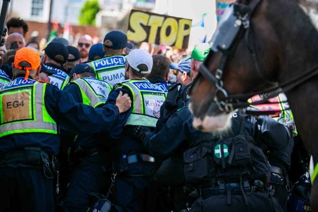 June 13, 2026, Brighton, UK: Brighton, UK. 13 June 2026. Police officers during an anti-immigration protest in the city centre of Brighton. The South East Patriots group hold a march through the centre of Brighton, with about twenty groups under the banner the Carnival Against Fascism organising a counter protest. Police officers kept the two groups apart as tensions were running high. South East Patriots claimed the protest was to demand stronger border control, enforcement of immigration laws, and the deportation of illegal immigrants, with the counter protest groups expressing their resistance against the far right as well as to any form of fascism and racism Brighton UK - ZUMAd99_ 20260613_zap_d99_083 Copyright: xMattxDuckettx