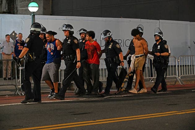 June 13, 2026, New York, New York, USA: June 13, 2026 - New York, NY, USA - Fans getting arrested after New York fans gather at a MSG watch party on 33rd Street to watch the New York Knicks win the NBA Final against the San Antonio Spurs 4-1 in Game 5 with a score of 94-90. The game had a lot of tense moments but the Knicks won in the last few minutes after trailing the Spurs through most of the game. (Photo: Andrea RENAULT Zuma Press) New York USA - ZUMAg115 20260613_faf_g115_021 Copyright: xAndreaxRenaultx