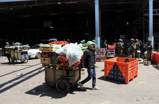 Israeli Forces Conduct Raid in Central Market Area of Nablus NABLUS, WEST BANK JUNE 14, 2026: Israeli soldiers are seen in the central vegetable market area during a military raid in the city of Nablus, in the occupied West Bank. NABLUS Palestine, State of Copyright: x xJNAxEDITORx xJNAxPressx