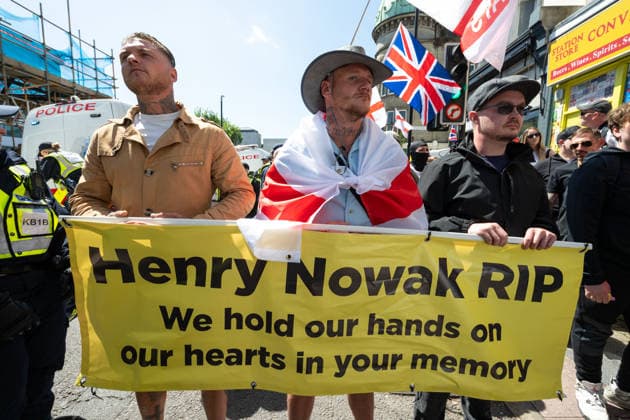 Anti-immigration and anti-racist demonstrators face off at the protests in Brighton - 13 Jun 2026 Protesters hold a banner in memory of Henry Nowak during the anti-immigration protest. Anti-immigration protesters gathered in Brighton city centre for a demonstration calling for stricter border controls, stronger enforcement of immigration laws and the deportation of illegal immigrants. The rally was met by thousands of counter protesters from anti-racist and anti-fascist groups taking part in a Carnival Against Fascism demonstration. Police maintained a large presence to separate the opposing groups as tensions flare. London United Kingdom Copyright: xAndreaxDomeniconix xSOPAxImagesx ADOMENICONI_BRIGHTON_PROTEST_Z63_0509