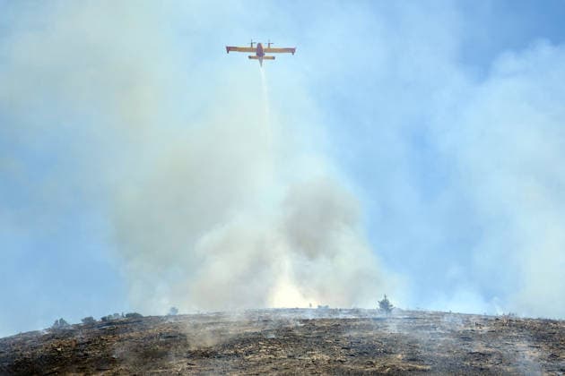 Wildfire continues to burn in Sicily s Trapani region as aerial response intensifies TRAPANI, ITALY - JUNE 14: Firefighting aircraft and helicopters operate to extinguish a wildfire that broke out in a maquis area near the Grande Montagna location in Trapani, on the west of Italy s Sicily Island, on June 14, 2026. The wildfire, which started yesterday afternoon, continues to spread despite ongoing aerial and ground efforts. Alberto Lo Bianco Anadolu Trapani Italy. Editorial use only. Please get in touch for any other usage.  Copyright: x2026xAnadoluxAlbertoxLoxBiancox