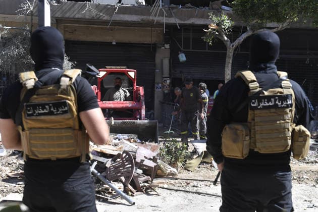 Israeli airstrike hits Beirut despite ceasefire: 3 killed BEIRUT, LEBANON - JUNE 14: Members of security forces and onlookers gather near a heavily damaged building following an Israeli airstrike on the Dahieh district in Beirut, Lebanon on June 14, 2026. Despite the ongoing ceasefire, Israeli attack killed three people and injured 15 others, causing severe destruction to the residential area. Houssam Shbaro Anadolu BeIrut Lebanon. Editorial use only. Please get in touch for any other usage.  Copyright: x2026xAnadoluxHoussamxShbarox