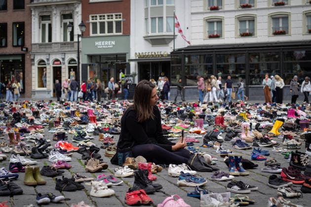 Commemoration in Bosch for Palestinian children and journalists killed by Israel BOSCH, NETHERLANDS - JUNE 14: Photographs and names of journalists killed in the Israeli attacks on Gaza, and thousands of children’s shoes are displayed during a commemoration event held for Palestinian children and journalists killed in Israel’s attacks on Gaza in Bosch, Netherlands on June 14, 2026. Organized by the Plant an Olive Tree Foundation in Markt Square in the city center of Den Bosch, the event honored Palestinian children and journalists who lost their lives in Israeli attacks in Gaza. Abdullah Asiran Anadolu Bosch Netherlands. Editorial use only. Please get in touch for any other usage.  Copyright: x2026xAnadoluxAbdullahxAsiranx
