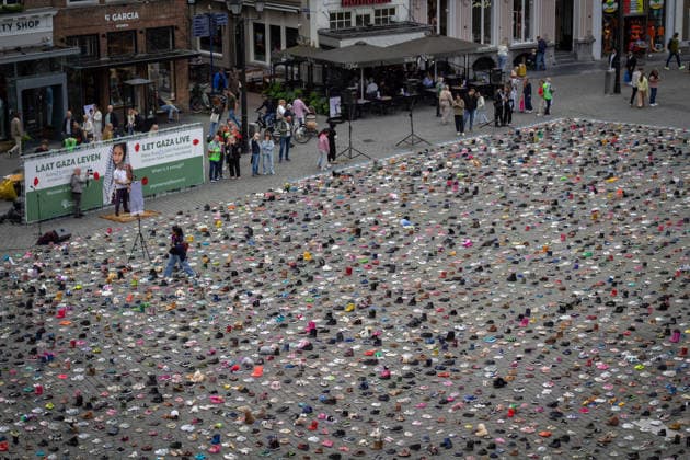 Commemoration in Bosch for Palestinian children and journalists killed by Israel BOSCH, NETHERLANDS - JUNE 14: Photographs and names of journalists killed in the Israeli attacks on Gaza, and thousands of children’s shoes are displayed during a commemoration event held for Palestinian children and journalists killed in Israel’s attacks on Gaza in Bosch, Netherlands on June 14, 2026. Organized by the Plant an Olive Tree Foundation in Markt Square in the city center of Den Bosch, the event honored Palestinian children and journalists who lost their lives in Israeli attacks in Gaza. Abdullah Asiran Anadolu Bosch Netherlands. Editorial use only. Please get in touch for any other usage.  Copyright: x2026xAnadoluxAbdullahxAsiranx