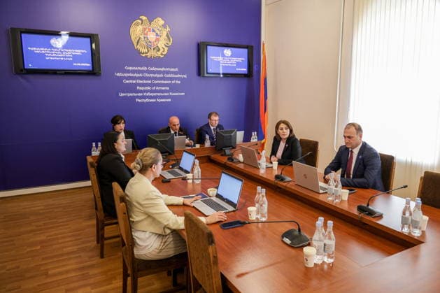 ARMENIA, YEREVAN - JUNE 14, 2026: President of the Central Election Commission of Armenia Vahagn Hovakimyan (C back) is seen in the offices of the Central Electoral Commission of Armenia during the announcement of the results of the 2026 Armenian parliamentary election Yerevan Armenia  - ZUMAt113 20260614_zaa_t113_086 Copyright: xAlexanderxPatrinx