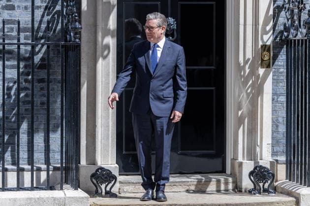June 14, 2026, London, United Kingdom: British Prime Minister Keir Starmer waits on the steps to welcome Japanese Prime Minister Sanae Takaichi (not in view) to Downing Street. London United Kingdom - ZUMAs197 20260614_aaa_s197_052 Copyright: xPhilxLewisx