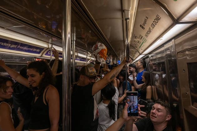 June 14, 2026, New York, United States: Knicks fans head to Manhattan on the Subway to celebrate after the New York Knicks defeated the San Antonio Spurs in Game 5 of the NBA Finals to win the series. The Knicks won the NBA Championship for the first time since 1973, for the third time in franchise history. New York United States - ZUMAs197 20260614_aaa_s197_073 Copyright: xRonxAdarx