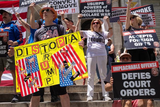 June 14, 2026, New York, New York, USA: Activist group Rise and Resist protest on the steps of the New York Public Library demanding to Ã¢â‚¬oeImpeach, Convict and RemoveÃ¢â‚¬Â PRESIDENT DONALD TRUMP from office. New York USA - ZUMAp288 20260614_znp_p288_003 Copyright: xSyndixPilarx