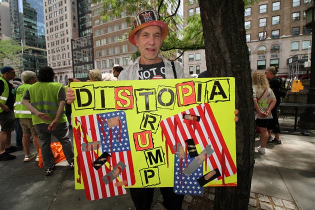 June 14, 2026, Manhattan, New York, USA: New York, New York June 14,.2026... The group Rise and Resist today protested President Trump by flying a 12 x 18 foot Ã¢â‚¬oedistressedÃ¢â‚¬Â American flag in front of a place free of Trump & Republicans, the steps of the New York Public Library. Manhattan USA  - ZUMAct2_ 20260614_faf_ct2_028 Copyright: xBrucexCotlerx