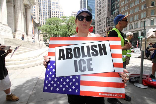 June 14, 2026, Manhattan, New York, USA: New York, New York June 14,.2026... The group Rise and Resist today protested President Trump by flying a 12 x 18 foot Ã¢â‚¬oedistressedÃ¢â‚¬Â American flag in front of a place free of Trump & Republicans, the steps of the New York Public Library. Manhattan USA  - ZUMAct2_ 20260614_faf_ct2_037 Copyright: xBrucexCotlerx