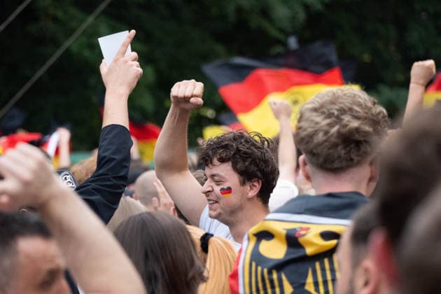 June 14, 2026, Frankfurt, Hesse, Germany: A fan celebrates Germany s fifth goal during the live broadcast of the FIFA World Cup match between Germany and Curacao in Frankfurt am Main, Germany. Frankfurt Germany  - ZUMAb332 20260614_zip_b332_012 Copyright: xMatiasxBasualdox