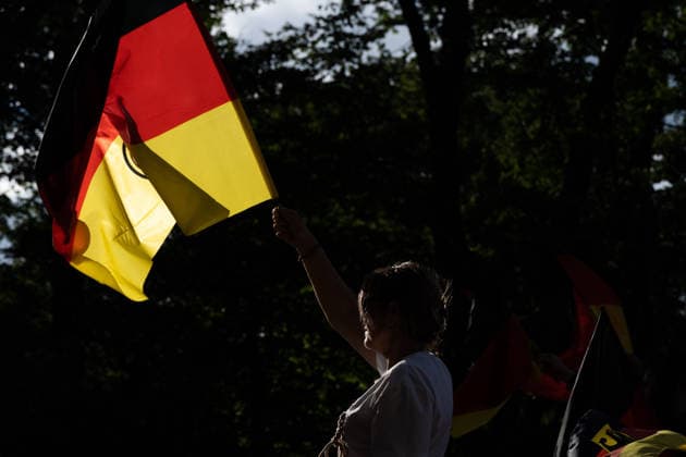 June 14, 2026, Frankfurt, Hesse, Germany: A woman waves a German flag during the live broadcast of the FIFA World Cup match between Germany and Curacao in Frankfurt am Main, Germany. Frankfurt Germany - ZUMAb332 20260614_zip_b332_017 Copyright: xMatiasxBasualdox