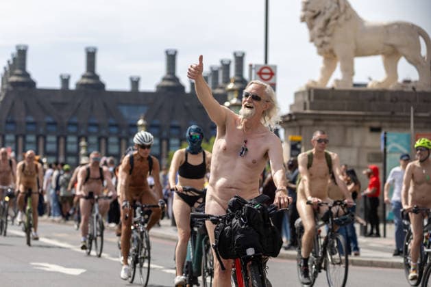 June 14, 2026, London, England, United Kingdom: Naked cyclists ride through Westminster during the annual World Naked Bike Ride, demanding greater respect for cyclists and protesting air pollution. London United Kingdom  - ZUMAs262 20260614_zip_s262_027 Copyright: xTayfunxSalcix