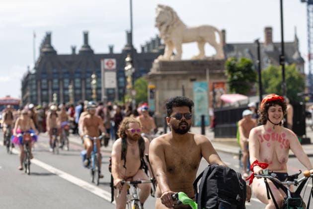 June 14, 2026, London, England, United Kingdom: Naked cyclists ride through Westminster during the annual World Naked Bike Ride, demanding greater respect for cyclists and protesting air pollution. London United Kingdom  - ZUMAs262 20260614_zip_s262_029 Copyright: xTayfunxSalcix