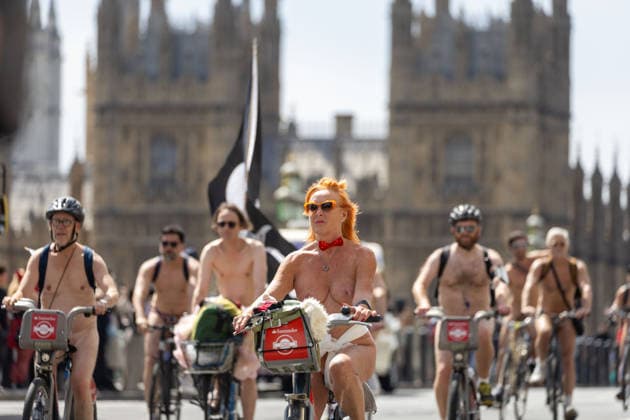 June 14, 2026, London, England, United Kingdom: Naked cyclists ride through Westminster during the annual World Naked Bike Ride, demanding greater respect for cyclists and protesting air pollution. London United Kingdom  - ZUMAs262 20260614_zip_s262_041 Copyright: xTayfunxSalcix