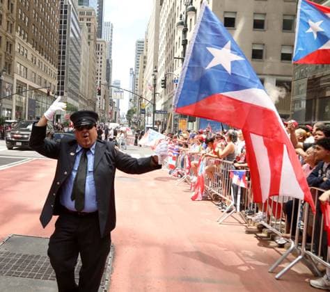 June 14, 2026, New York, New York, USA: A PARADE GOER seen at the 69th Annual National Puerto Rican Parade held on 5th Avenue. New York USA - ZUMAk03_ 20260614_zaf_k03_048 Copyright: xNancyxKaszermanx