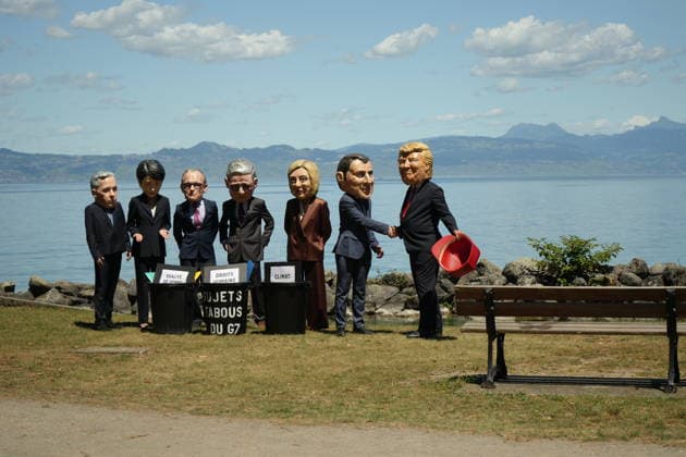 Oxfam protest ahead of G7 Summit in France EVIAN-LES-BAINS, FRANCE - JUNE 14: Activists wearing oversized papier-mache masks depicting world leaders, including U.S. President Donald Trump and French President Emmanuel Macron, take part in an Oxfam demonstration ahead of the G7 Summit in Evian-les-Bains, France, on June 14, 2026. The anti-poverty charity staged the protest to call attention to climate change and gender equality issues ahead of the gathering of G7 leaders. Stringer Anadolu Evian-les-Bains France. Editorial use only. Please get in touch for any other usage.  Copyright: x2026xAnadoluxStringerx