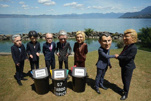 Oxfam protest ahead of G7 Summit in France EVIAN-LES-BAINS, FRANCE - JUNE 14: Activists wearing oversized papier-mache masks depicting world leaders, including U.S. President Donald Trump and French President Emmanuel Macron, take part in an Oxfam demonstration ahead of the G7 Summit in Evian-les-Bains, France, on June 14, 2026. The anti-poverty charity staged the protest to call attention to climate change and gender equality issues ahead of the gathering of G7 leaders. Stringer Anadolu Evian-les-Bains France. Editorial use only. Please get in touch for any other usage.  Copyright: x2026xAnadoluxStringerx