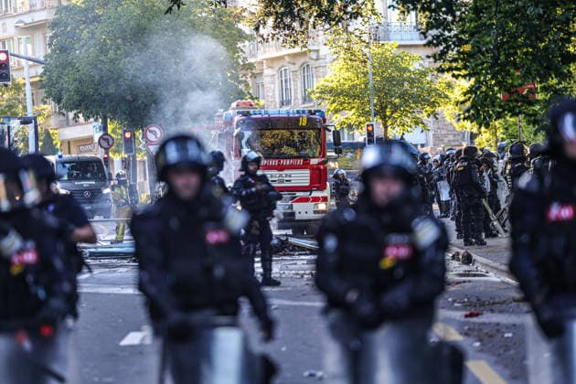 June 14, 2026, Geneva, Switzerland, European Union: Police officers in riot gear stand as a fire truck is seen through lingering tear gas smoke during demonstrations in Geneva ahead of the G7 summit, which begins tomorrow in Evian-les-Bains. Geneva European Union  - ZUMAo116 20260614_znp_o116_045 Copyright: xBiancaxOterox