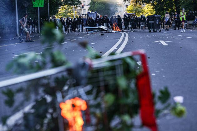 June 14, 2026, Geneva, Switzerland, European Union: A police cordon with police in riot gear seen down a road with a fire in front of them during demonstrations in Geneva ahead of the G7 summit, which begins tomorrow in Evian-les-Bains. Geneva European Union  - ZUMAo116 20260614_znp_o116_050 Copyright: xBiancaxOterox