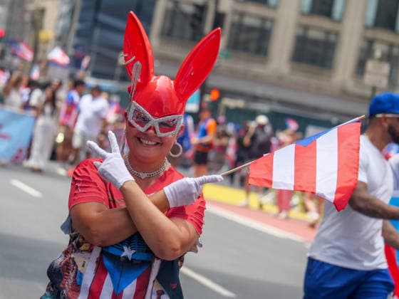 June 14, 2026, New York, New York, USA: The 69th annual Puerto Rican Day Parade made its way up Fifth Avenue.to a sea of red white and blue celebrating the expansive cultural legacy and global footprint of .Puerto Rico. Salsa music, floats, dance and Puerto Rican pride filled the air as thousands marched and.watched from the sidelines. New York USA  - ZUMAh156 20260614_znp_h156_017 Copyright: xMiloxHessx