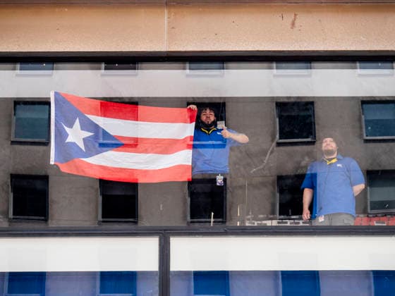 June 14, 2026, New York, New York, USA: Workers in an office building watching the 69th annual Puerto Rican Day Parade made its way up Fifth Avenue.to a sea of red white and blue celebrating the expansive cultural legacy and global footprint of .Puerto Rico. Salsa music, floats, dance and Puerto Rican pride filled the air as thousands marched and.watched from the sidelines. New York USA - ZUMAh156 20260614_znp_h156_005 Copyright: xMiloxHessx