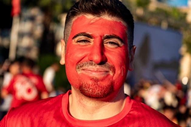 Turkish Fans Gather for the Match A Turkish fan wearing face paint stands among supporters gathered to watch the FIFA World Cup Group D match between Turkey and Australia on a giant screen in the Konak district of Izmir, Turkey, on June 14, 2026. This marks Turkey s first appearance in the FIFA World Cup finals since the 2002 tournament. Turkey finished third at the 2002 FIFA World Cup. Izmir Izmir Turkey Copyright: xMuratxKocabasx