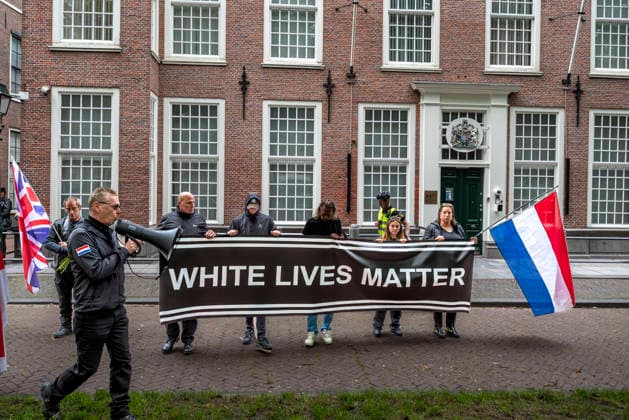 June 14, 2026, Den Haag, South Holland, Netherlands: Around 50 far-right demonstrators gathered on Burgemeester Patijnlaan for a memorial march for Henry Nowak (18, British Polish university student). Nowak was killed on 3 December 2025 by Vickrum Singh Digwa in Southampton, England. The march ended at the Embassy of Great Britain, where demonstrators laid a wreath and flowers, and held banners saying Justice for Henry and White Lives Matter. Den Haag Netherlands  - ZUMAp202 20260614_zip_p202_004 Copyright: xJamesxPetermeierx