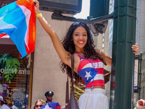 June 14, 2026, New York, New York, USA: Puerto Rican pride at the 69th annual Puerto Rican Day Parade which made its way up Fifth Avenue to a sea of red white and blue celebrating the expansive cultural legacy and global footprint of Puerto Rico, Salsa music, floats, dance and Puerto Rican pride filled the air as thousands marched and watched from the sidelines. New York USA - ZUMAh156 20260614_znp_h156_006 Copyright: xMiloxHessx