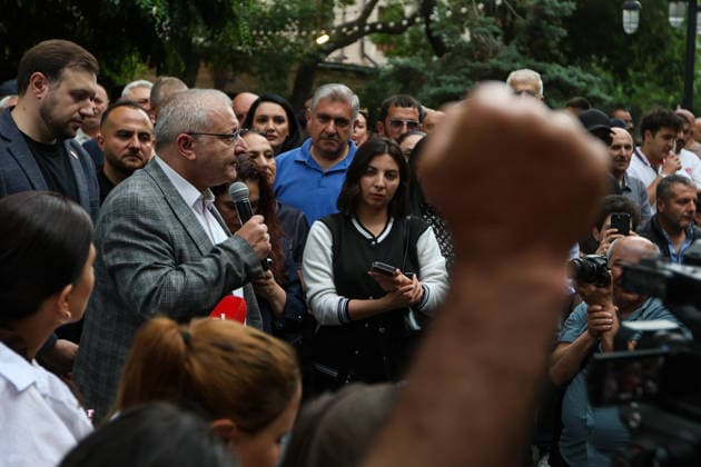 June 14, 2026, Yerevan, Armenia: Prosperous Armenia Party candidate Suren Surenyants talks to the crowd of protestors during the rally. Armenia™s Central Election Commission (CEC) has certified the results of the June 7 parliamentary elections, confirming that Prime Minister Nikol Pashinyan™s Civil Contract party secured 49.74% of the vote, enough to form a government independently without coalition partners. The Prosperous Armenia party, led by billionaire Gagik Tsarukyan, narrowly failed to clear the 4% parliamentary threshold and called on its supporters to gather outside the CEC building in protest. Opposition, rejecting the outcome as illegitimate, addressed crowds demanding a rerun of the vote. Yerevan Armenia - ZUMAs197 20260614_aaa_s197_222 Copyright: xYanxKhachkox