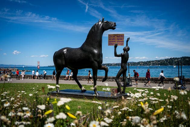 Demonstration against the G7 summit in Geneva on June 14, 2026 Nicolas Liponne MAXPPP Geneve 14 06 2026 A statue of a horse and a man holding a sign that reads We dont want your cannibalistic, inhumane, bellicose, deceitful world, during the international demonstration against fascism, capitalism and imperialism, as part of the mobilization of the G7 counter summit, qui aura lieu à Évian du 15 au 17 juin, à Genève le 14 juin 2026 A statue of a horse and a man holding a sign that reads We dont want your cannibalistic, inhumane, bellicose, deceitful world, at the international demonstration against fascism, capitalism, and imperialism, as part of the mobilization for the G7 counter summit, which will take place in Évian from June 15 to 17, i  Copyright: xMAXPPPxNicolasxLiponnex NLP202606152272 NLP202606152272