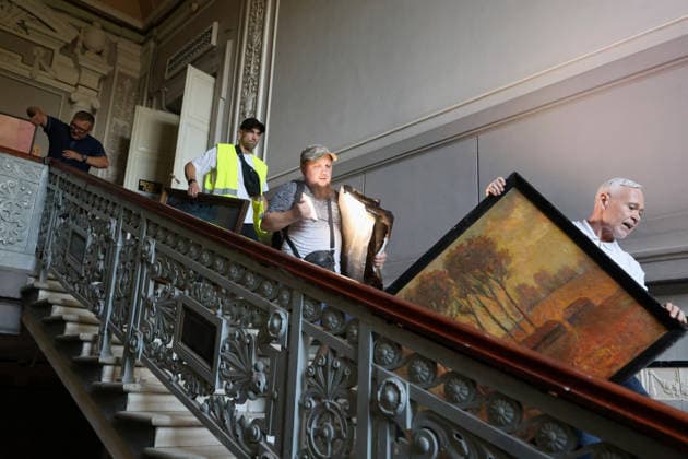 Kharkiv city head Ihor Terekhov (R) joins the effort to rescue paintings at the Kharkiv Art Museum that caught fire due to a Russian drone strike, Kharkiv, Ukraine, June 14, 2026. The Russian army attacked the northeastern city with drones, injuring five people, including a one-month-old baby. On the afternoon of June 14, Russians struck two districts of Kharkiv with drones. (Photo by Viacheslav Madiievskyi Ukrinform) Russians strike Kharkiv Art Museum with drone  Copyright: xViacheslavxMadiievskyix