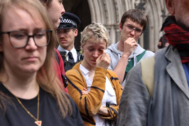 June 15, 2026, London, London, UK: London, UK. People react outside the Royal Courts of Justice in central London as they listen to court proceedings after the Court of Appeal ruled that the government s proscription of Palestine Action as a terrorist organisation is lawful, upholding the ban following a legal challenge. London UK  - ZUMAl94_ 20260615_zaf_l94_021 Copyright: xDinendraxHariax