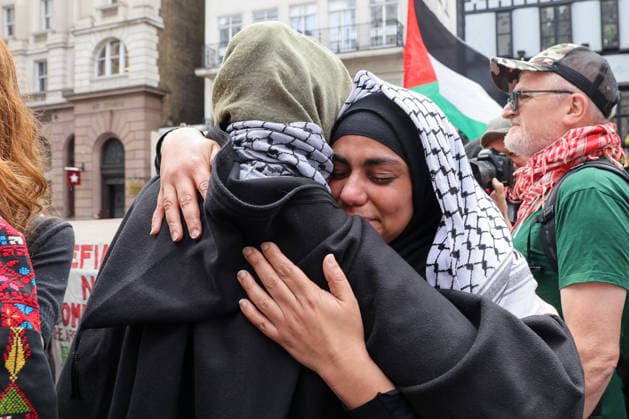 June 15, 2026, London, London, UK: London, UK. People react outside the Royal Courts of Justice in central London as they listen to court proceedings after the Court of Appeal ruled that the government s proscription of Palestine Action as a terrorist organisation is lawful, upholding the ban following a legal challenge. London UK  - ZUMAl94_ 20260615_zaf_l94_034 Copyright: xDinendraxHariax