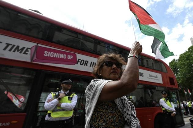 Lift The Ban protest in London ahead of the Palestine Action trial LONDON, UNITED KINGDOM - JUNE 15: Pro-Palestinian demonstrators gather outside the Royal Courts of Justice, holding flags and banners, to demand the lifting of the ban on the direct action group Palestine Action ahead of a landmark ruling in London, United Kingdom, on June 15, 2026. Rasid Necati Aslim Anadolu London United Kingdom. Editorial use only. Please get in touch for any other usage.  Copyright: x2026xAnadoluxRasidxNecatixAslimx