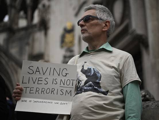 UK Court of Appeal upholds ban on Palestine Action LONDON, UNITED KINGDOM - JUNE 15: Demonstrators, holding banners and placards, gather outside the Royal Courts of Justice during a Lift The Ban protest organized by Defend Our Juries, following a Court of Appeal ruling that upheld the legality of the ban on Palestine Action, a group known for targeting companies linked to Israel, in London, United Kingdom, on June 15, 2026. Rasid Necati Aslim Anadolu London United Kingdom. Editorial use only. Please get in touch for any other usage.  Copyright: x2026xAnadoluxRaÅüidxNecatixAslÄ±mx