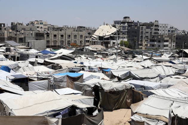 Displacement tents crowd ruins in western Gaza City Tents sheltering displaced Palestinians stand among the rubble of destroyed buildings in western Gaza City on June 15, 2026. Displaced residents continue to face mounting challenges due to damaged infrastructure and shortages of basic services, while cases of skin diseases among children are increasing in displacement camps and shelters across the Gaza Strip. Photo by Bilal Osama apaimages Gaza city Gaza Strip Palestinian Territory 150626_Gaza_BO_02(6) Copyright: xapaimagesxBilalxOsamax xapaimagesx