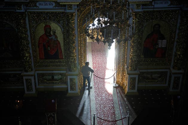 A man is inside the Dormition Cathedral at the Kyiv Pechersk Lavra, where the roof caught fire during a massive Russian combined attack, Kyiv, Ukraine, June 15, 2026. The Russian army launched a large-scale assault on the Ukrainian capital with missiles and strike drones, killing four people and injuring 28, including children and a pregnant woman. At least 140,000 consumers were left without electricity due to damage to power grids. Residential buildings, the Kyiv Pechersk Lavra, the Mystetskyi Arsenal Museum Complex, the Dovzhenko Film Studio, and the building of the High Anti-Corruption Court sustained damage. (Photo by Marianna Kotyk Ukrinform) Massive Russian attack damages Kyiv Pechersk Lavra and Mystetskyi Arsenal in Kyiv  Copyright: xMariannaxKotykx