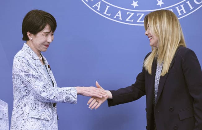 Japan-Italy summit Japanese Prime Minister Sanae Takaichi (L) shakes hands with her Italian counterpart Giorgia Meloni during a joint press event held following their talks in Rome on June 15, 2026. (Pool photo)  A14AA0005618922P