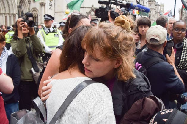 June 15, 2026, London, England, United Kingdom: Protesters react outside the Royal Courts of Justice as the ban on the activist group Palestine Action is ruled as lawful by the Court of Appeal. Judges have overturned a previous ruling that the ban on the group was wrong. London United Kingdom - ZUMAv130 20260615_zip_v130_002 Copyright: xVukxValcicx