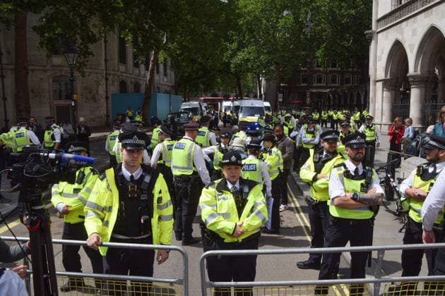 June 15, 2026, London, England, United Kingdom: Police officers arrest protesters outside the Royal Courts of Justice as the ban on the activist group Palestine Action is ruled as lawful by the Court of Appeal. Judges have overturned a previous ruling that the ban on the group was wrong. Protesters sat outside the court with placards stating Ã¢â‚¬ËœSaving lives is not terrorism, I support Palestine ActionÃ¢ London United Kingdom  - ZUMAv130 20260615_zip_v130_011 Copyright: xVukxValcicx
