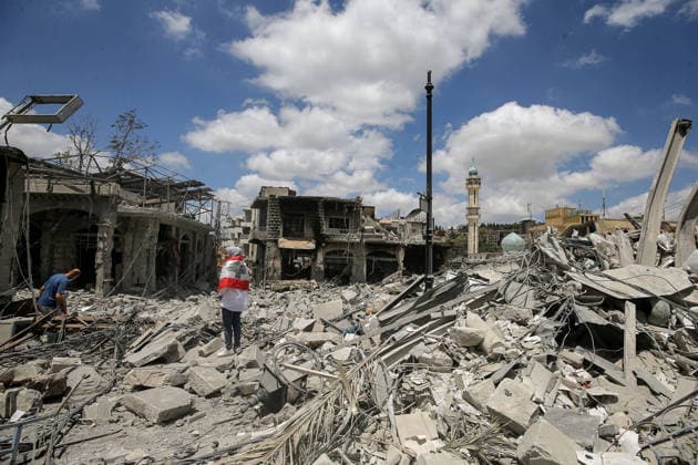 June 15, 2026, Nabatieh, Nabatieh, Lebanon: A Lebanese woman inspects destruction after returning to the southern Lebanese city of Nabatieh.. Scores of families started to return to their villages following the announcement of an initial ceasefire agreement between the United States and Iran. Nabatieh Lebanon  - ZUMAn313 20260615_zip_n313_009 Copyright: xMarwanxNaamanix