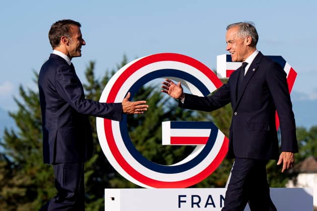 June 15, 2026, Evian-Les-Bains, France: Prime Minister Mark Carney, right, is greeted by Emmanuel Macron, President of France, during the G7 summit in Evian-les-Bains, France on Monday, June 15, 2026. Evian-Les-Bains France  - ZUMAc35_ 20260615_zaf_c35_051 Copyright: xChristopherxKatsarovx