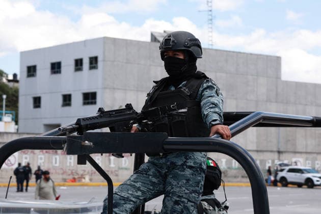 CNTE teachers protest in Mexico City on 15th day of strike MEXICO CITY, MEXICO - JUNE 15: A member of Mexico s National Guard stands on a patrol vehicle during a protest by CNTE teachers, at a toll booth in southern Mexico City, Mexico on June 15, 2026. Members of National Coordination of Education Workers (CNTE) staged protests at multiple toll booths, allowing motorists to pass without paying as their national strike reached its 15th day. Daniel Cardenas Anadolu Mexico City Mexico. Editorial use only. Please get in touch for any other usage.  Copyright: x2026xAnadoluxDanielxCardenasx