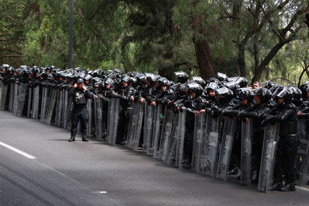 CNTE teachers protest in Mexico City on 15th day of strike MEXICO CITY, MEXICO - JUNE 15: Riot police stand guard during a protest by CNTE teachers at a toll booth in southern Mexico City, Mexico on June 15, 2026. Members of National Coordination of Education Workers (CNTE) staged protests at multiple toll booths, allowing motorists to pass without paying as their national strike reached its 15th day. Daniel Cardenas Anadolu Mexico City Mexico. Editorial use only. Please get in touch for any other usage.  Copyright: x2026xAnadoluxDanielxCardenasx