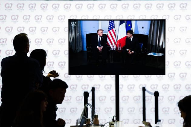 June 15, 2026, Evian-Les-Bains, France, European Union: Journalists watch inside the IMC as U.S. President DONALD TRUMP and French President EMMANUEL MACRON are broadcast during the opening day of the G7 summit in Evian-les-Bains. Evian-Les-Bains European Union - ZUMAo116 20260615_znp_o116_053 Copyright: xBiancaxOterox